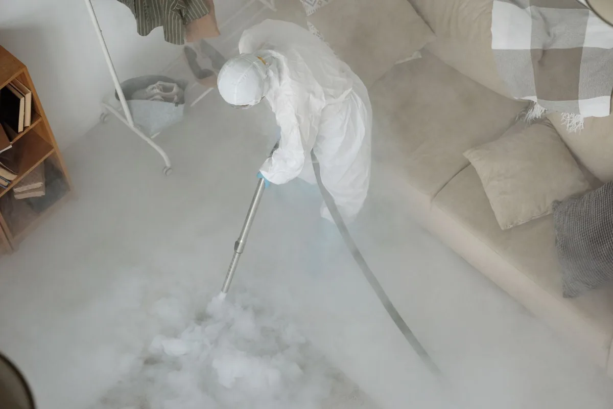 Biohazard cleanup technician in protective equipment, Garden City, NY